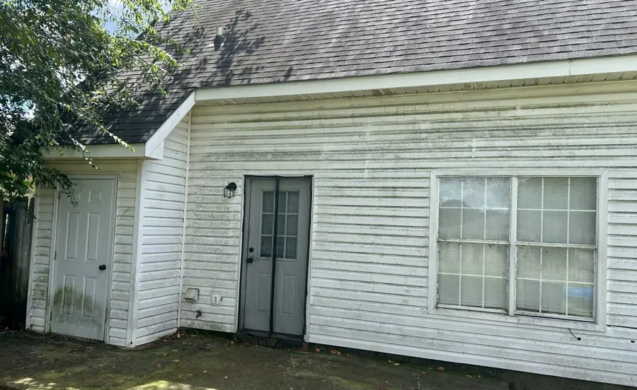 White siding on the back of a house